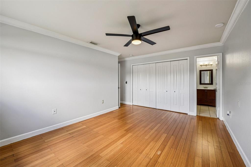 926 Lake Destiny Road, Unit F Altamonte Springs, FL 32714 - Photo 12 of 20 a view of empty room with wooden floor and fan