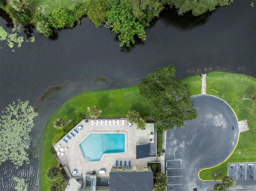 926 Lake Destiny Road, Unit F Altamonte Springs, FL 32714 - Photo 18 of 20 an aerial view of a house with garden space and street view