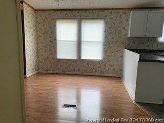 108 McIver Road Raeford, NC 28376 - Photo 16 of 40 a view of hallway with window and wooden floor