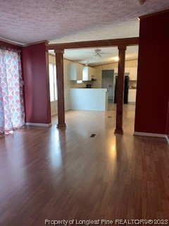 108 McIver Road Raeford, NC 28376 - Photo 23 of 40 an empty room with wooden floor and windows