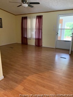 108 McIver Road Raeford, NC 28376 - Photo 26 of 40 an empty room with wooden floor and windows