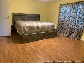 108 McIver Road Raeford, NC 28376 - Photo 30 of 40 a bedroom with a bed and a table