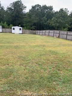 108 McIver Road Raeford, NC 28376 - Photo 34 of 40 a view of a swimming pool with a yard