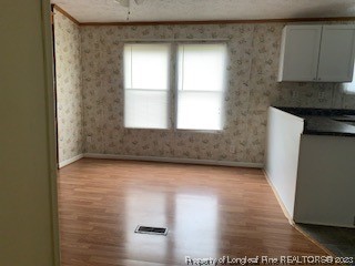 108 McIver Road Raeford, NC 28376 - Photo 9 of 40 a view of a kitchen with wooden floor and a sink