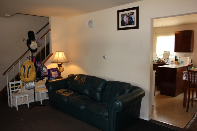 1178 Nantucket Road Aurora, IL 60506 - Photo 20 of 24 a living room with furniture and a flat screen tv