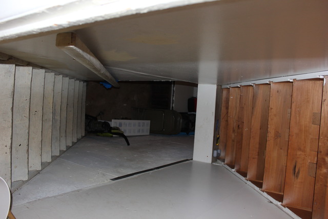 1178 Nantucket Road Aurora, IL 60506 - Photo 22 of 24 a view of a hallway with wooden walls and stairs