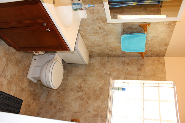 1178 Nantucket Road Aurora, IL 60506 - Photo 7 of 24 a bathroom with a sink and a mirror