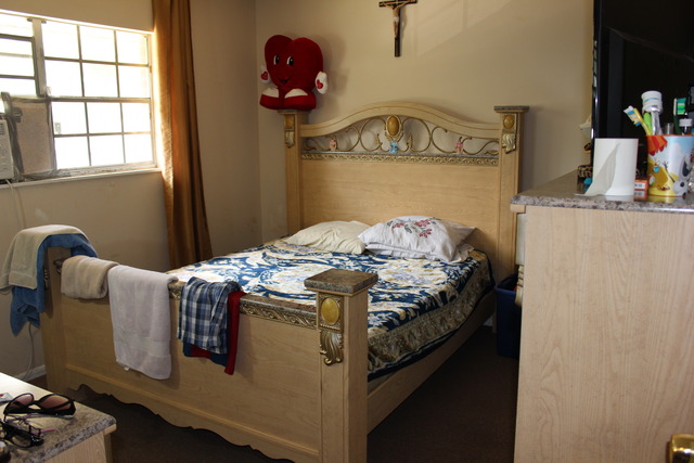 1178 Nantucket Road Aurora, IL 60506 - Photo 8 of 24 a bed sitting in a bedroom next to a window
