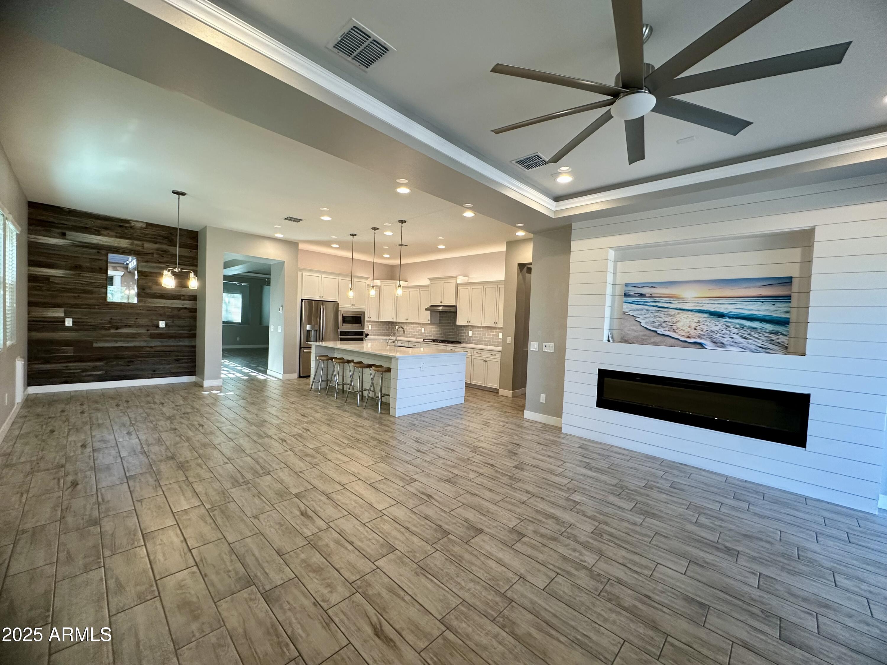 4230 East Ronald Street Gilbert, AZ 85295 - Photo 3 of 15 a view of kitchen with furniture and a ceiling fan