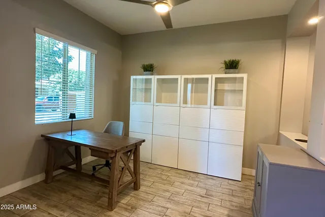 a workspace with furniture and a window