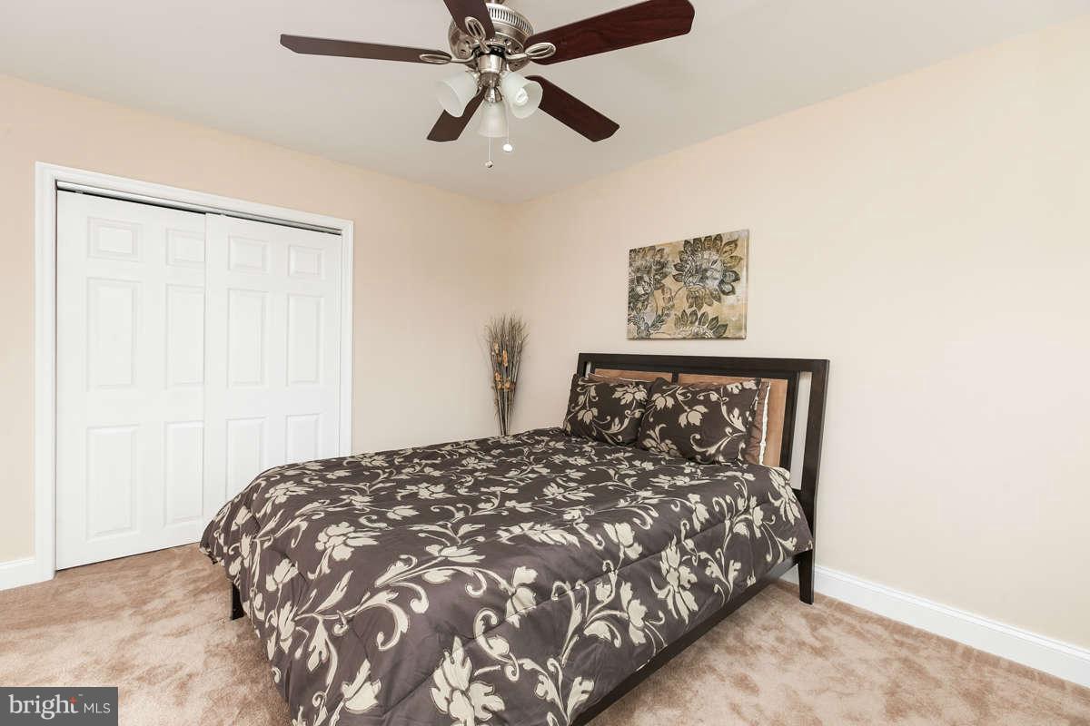 1554 Stonewood Road Baltimore, MD 21239 - Photo 15 of 30 Master Bed with new carpet and ceiling fans