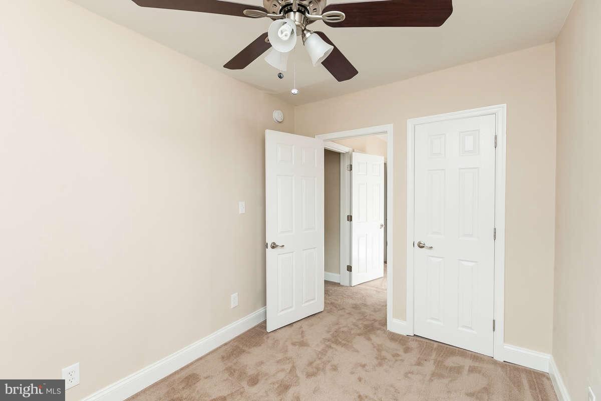 1554 Stonewood Road Baltimore, MD 21239 - Photo 19 of 30 Bedroom with ceiling fans