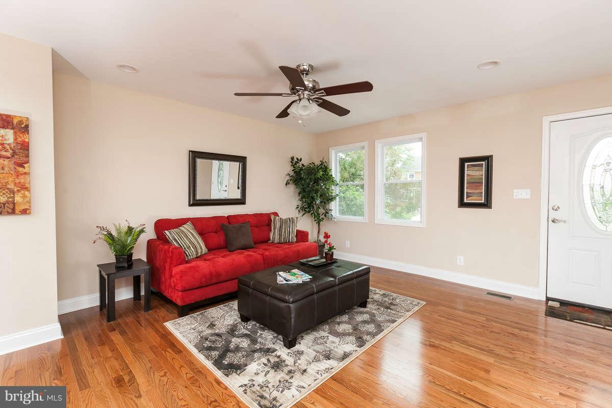 1554 Stonewood Road Baltimore, MD 21239 - Photo 4 of 30 Living Room with Gleaming Hardwood Floors