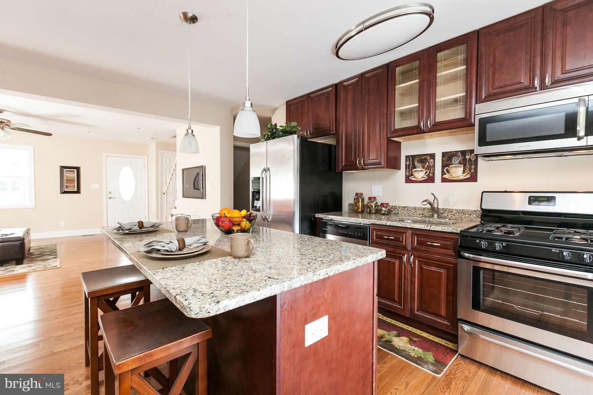 1554 Stonewood Road Baltimore, MD 21239 - Photo 6 of 30 Kitchen with bar seating