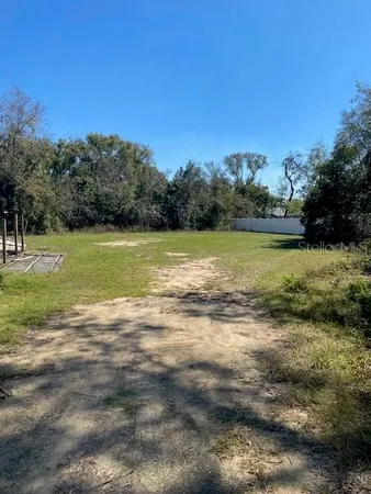 a view of a yard with a lake view
