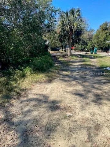 a backyard of a house and trees