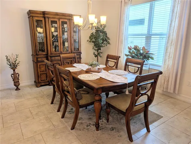 a spacious bathroom with a granite countertop tub sink and mirror