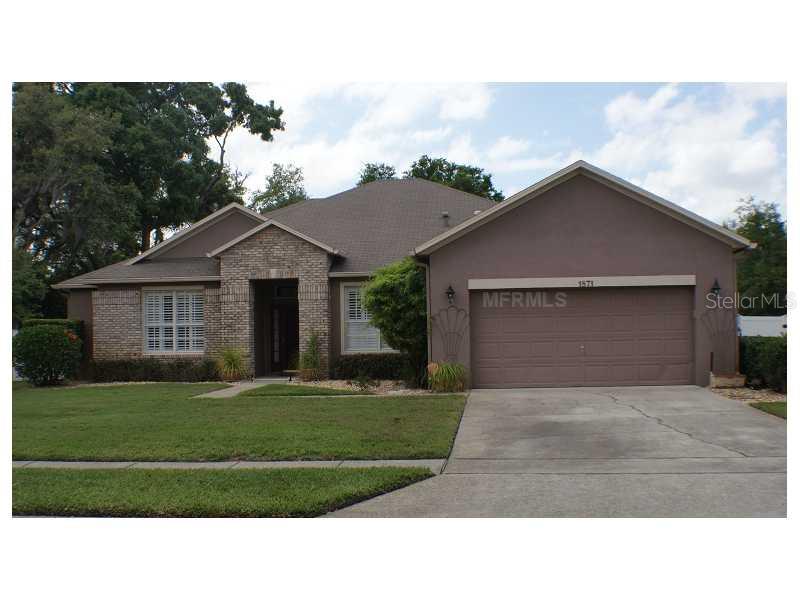 1871 Rachels Ridge Loop Ocoee, FL 34761 - Photo 1 of 1 a black and white house with a yard
