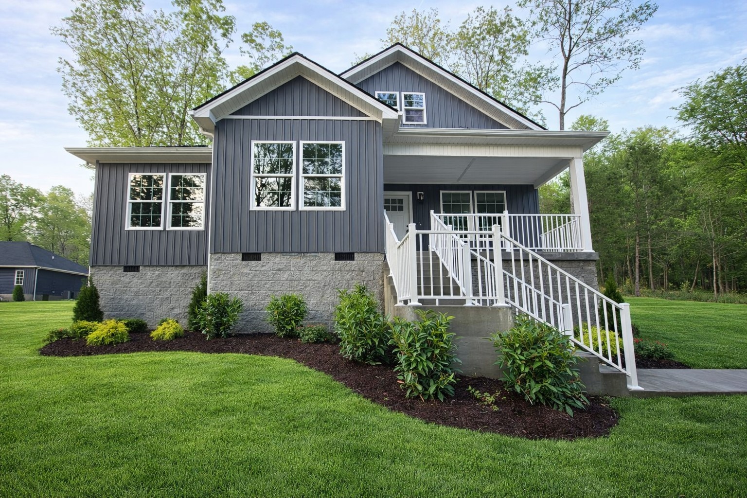 a front view of a house with a yard and porch