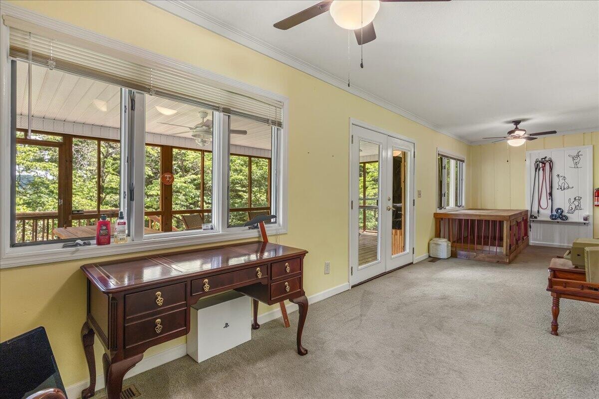 2522 Cindy Street Athens, TN 37303 - Photo 28 of 36 a living room with furniture a flat screen tv and a large window