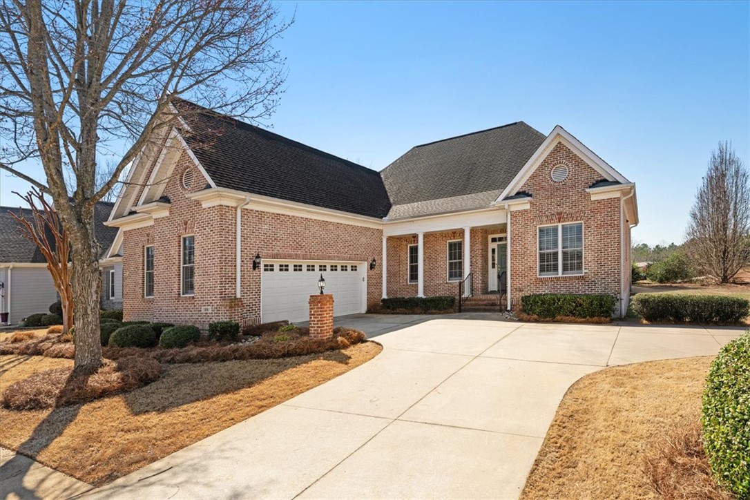 38 Angus Run Seneca, SC 29672 - Photo 2 of 46 This brick home boasts a pristine driveway, offering convenient parking and curb appeal.