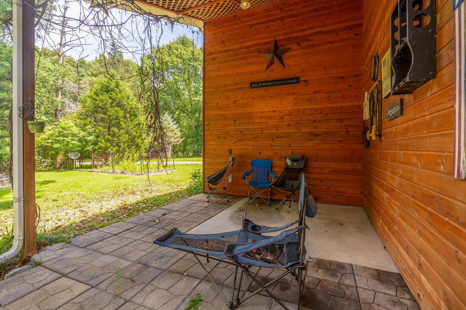 19 Pump Station Road Makanda, IL 62958 - Photo 35 of 36 a view of a patio with a table and chairs next to a yard