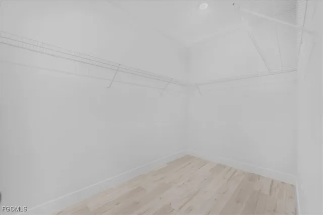 a view of an empty room and a window
