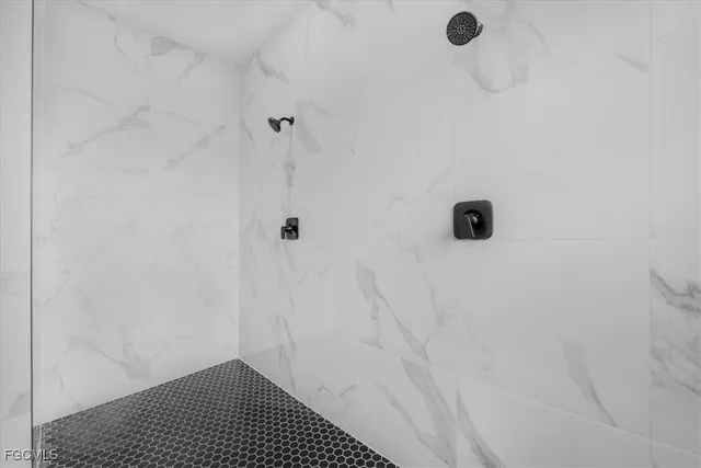 a spacious bathroom with double sink and a mirror