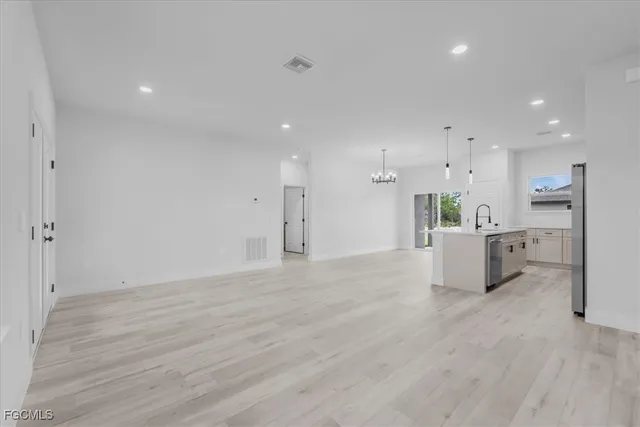 a view of kitchen with wooden floor