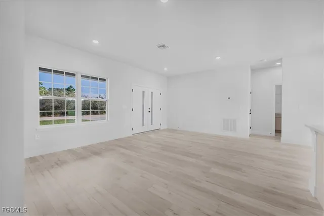 a view of empty room with windows