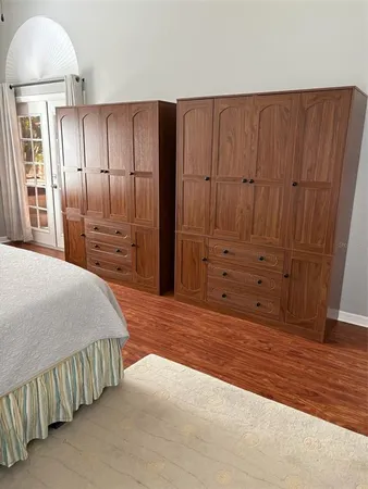 a room with a bed and a lamp