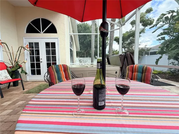 a view of a dinning table and chair in the patio