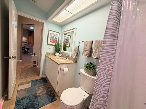 a bedroom with two beds and a window