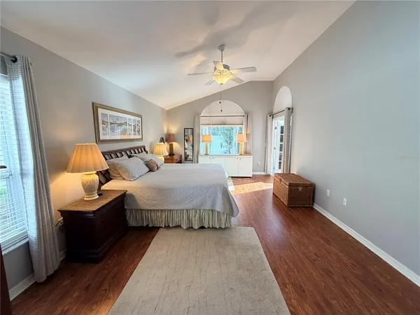 a bedroom with bed and window