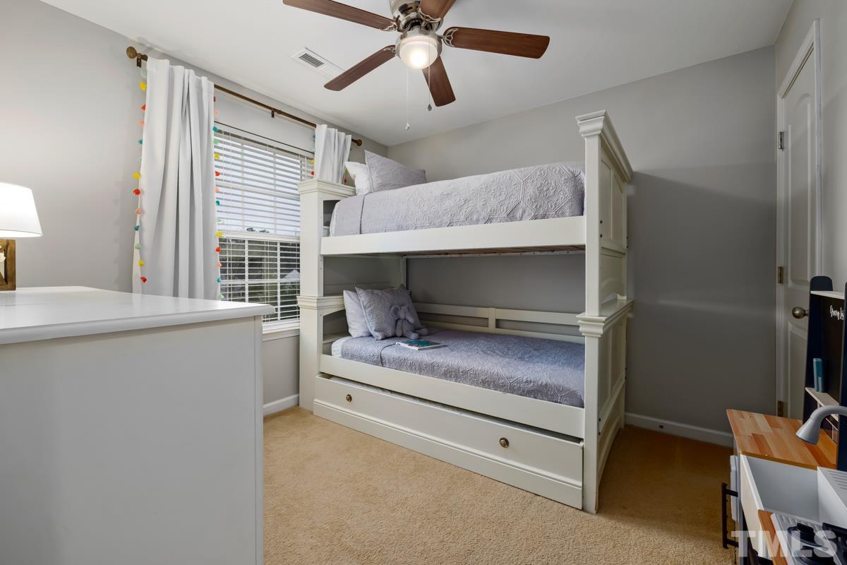 1205 Lombar Street Raleigh, NC 27610 - Photo 25 of 31 a bedroom with a bed and a window