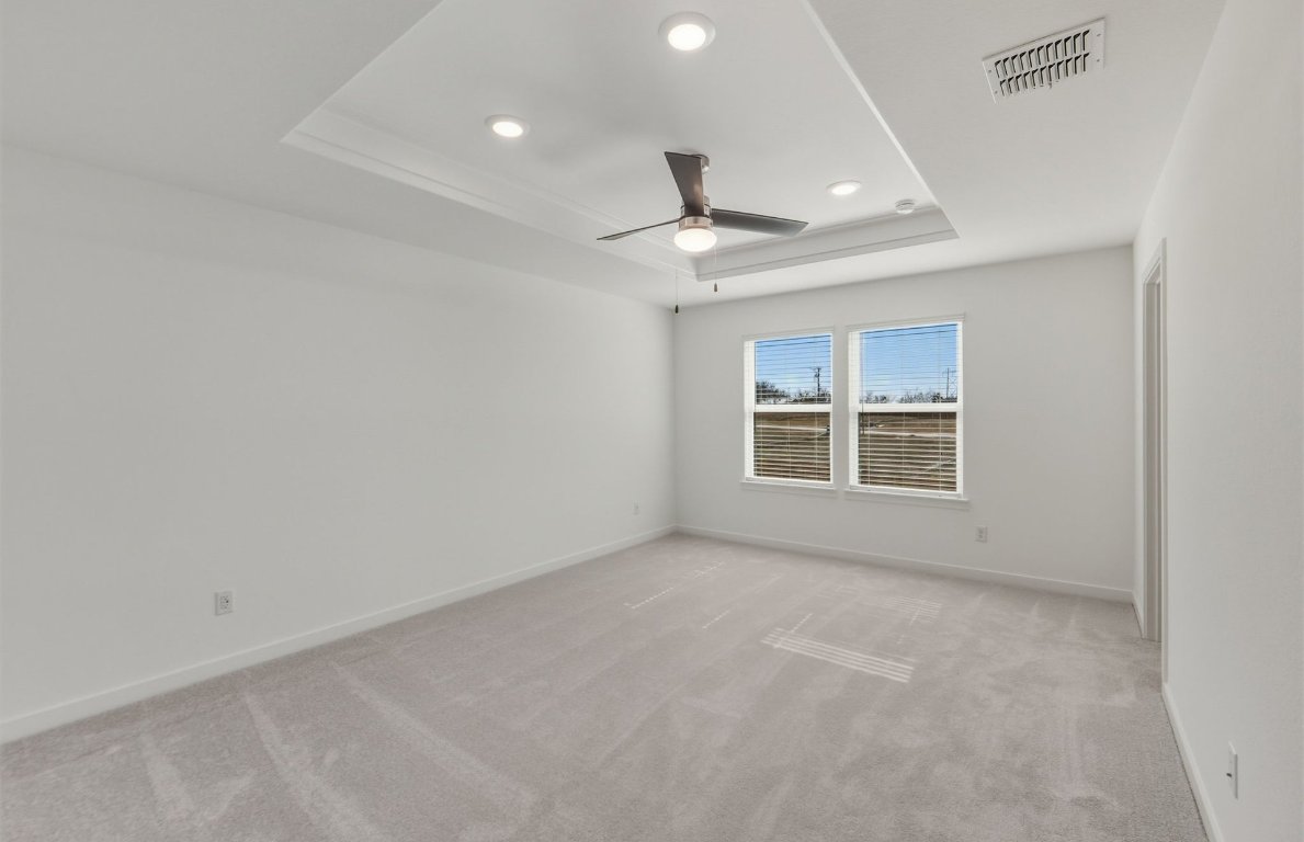 172 Golden Bell Way Buda, TX 78610 - Photo 9 of 24 an empty room with a empty space and windows