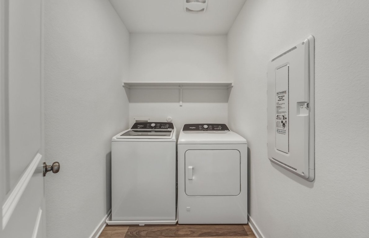 172 Golden Bell Way Buda, TX 78610 - Photo 19 of 24 a utility room with dryer and washer
