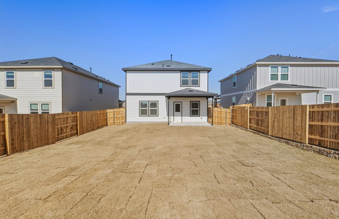 172 Golden Bell Way Buda, TX 78610 - Photo 20 of 24 a front view of a house with a yard