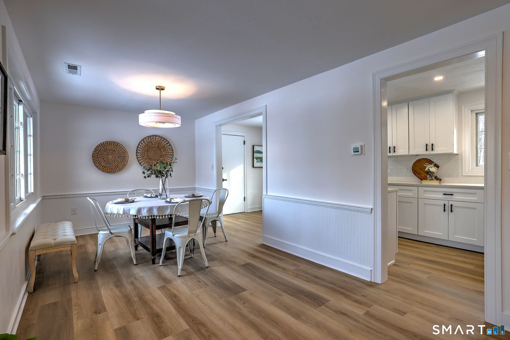 53 Geer Street Cromwell, CT 06416 - Photo 15 of 44 a view of a dining room with furniture and wooden floor