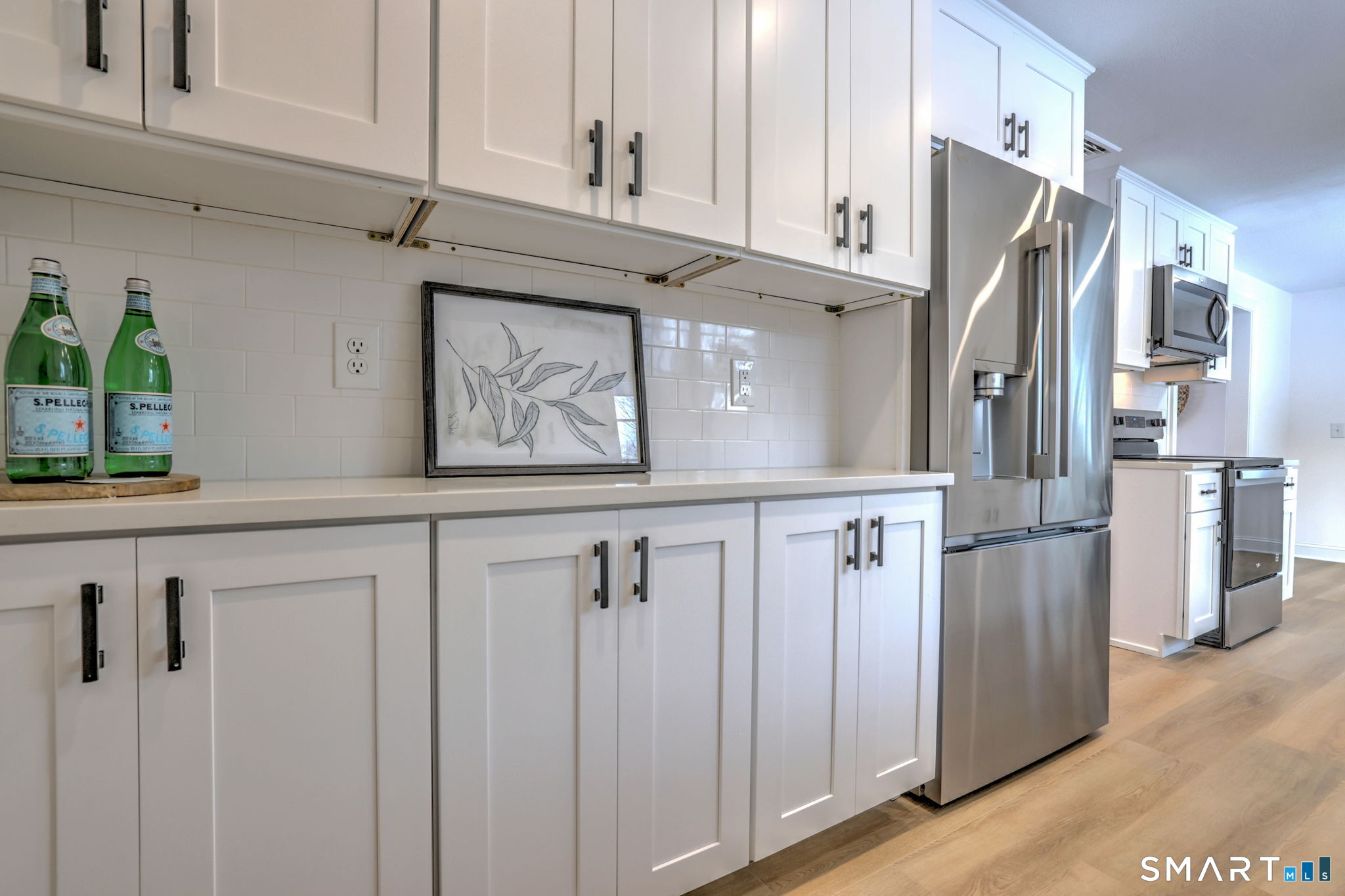 53 Geer Street Cromwell, CT 06416 - Photo 22 of 40 a kitchen with stainless steel appliances granite countertop a refrigerator and a cabinets