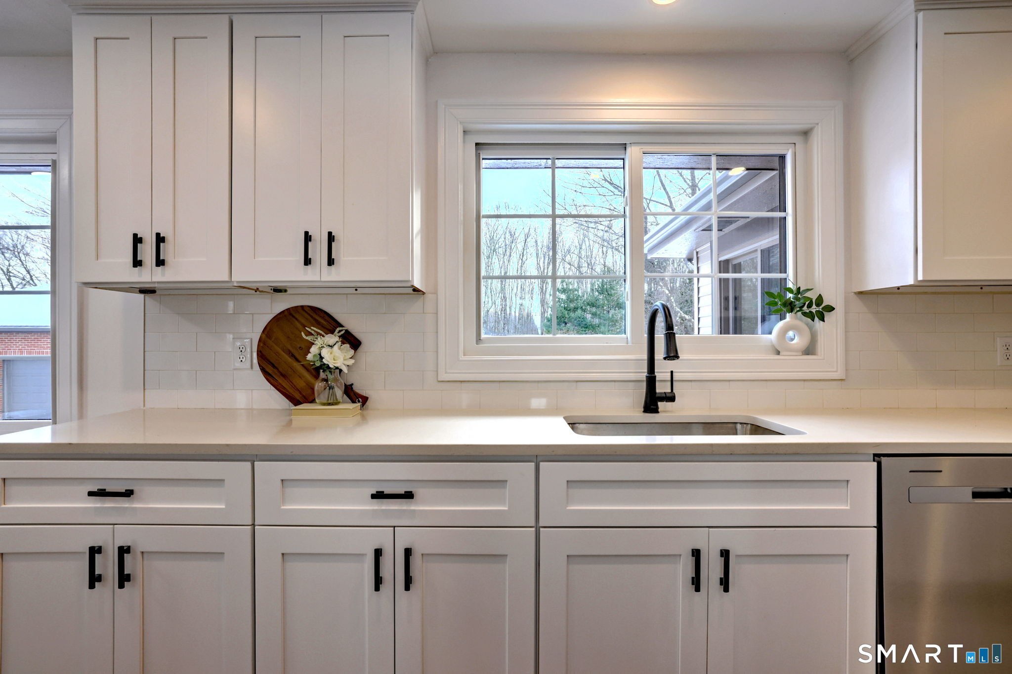 53 Geer Street Cromwell, CT 06416 - Photo 23 of 44 a kitchen with a sink and a window