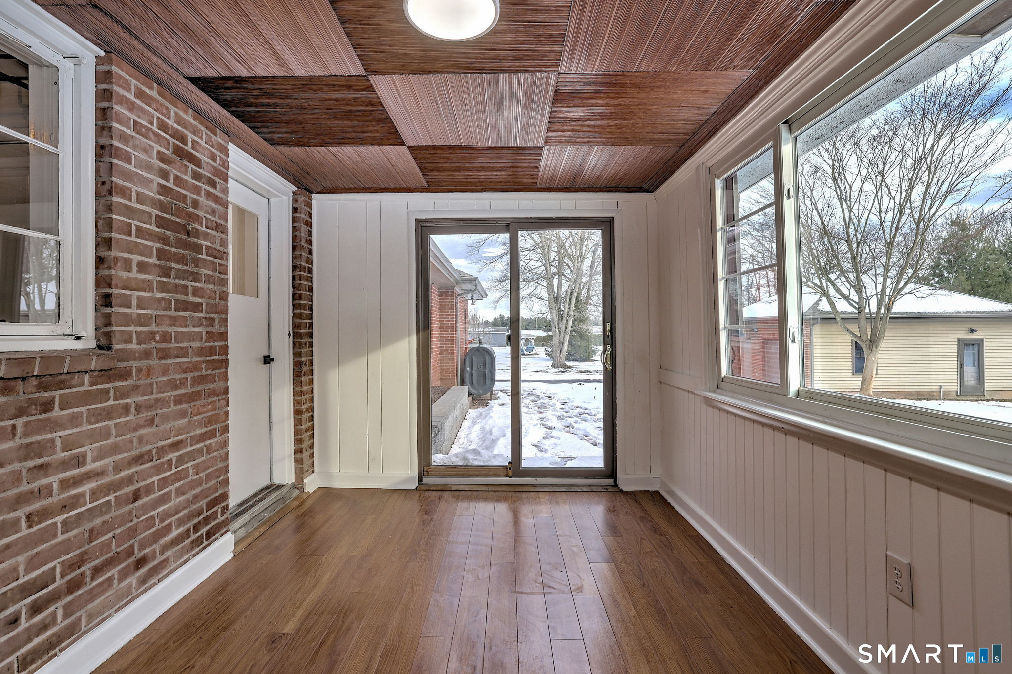 53 Geer Street Cromwell, CT 06416 - Photo 24 of 40 a view of an empty room with wooden floor and a window