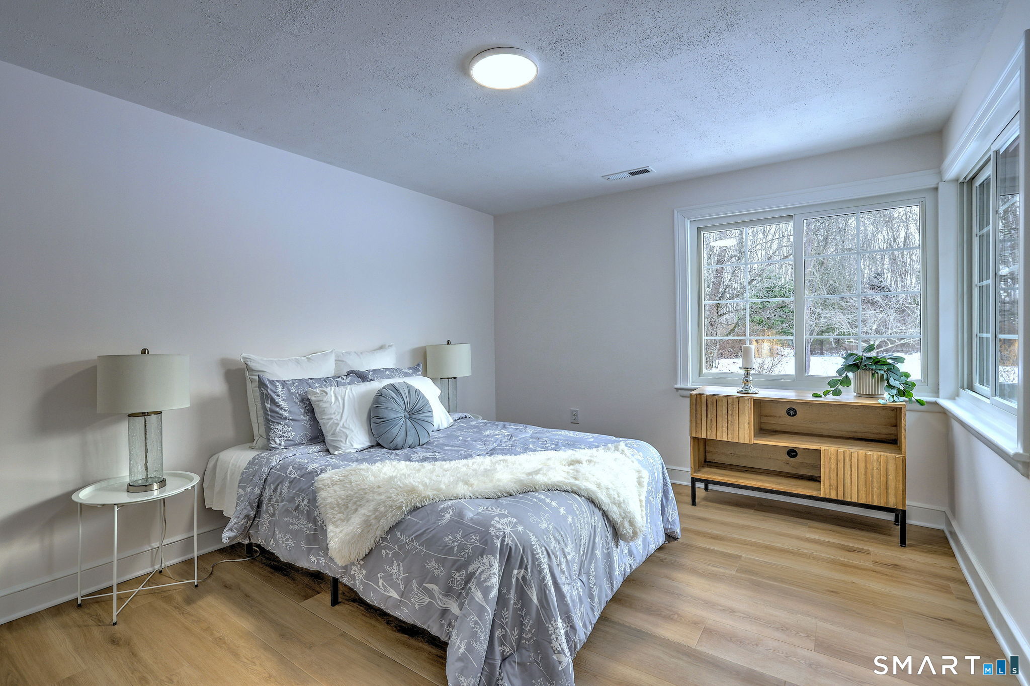 53 Geer Street Cromwell, CT 06416 - Photo 28 of 40 a bedroom with a large bed and a large window