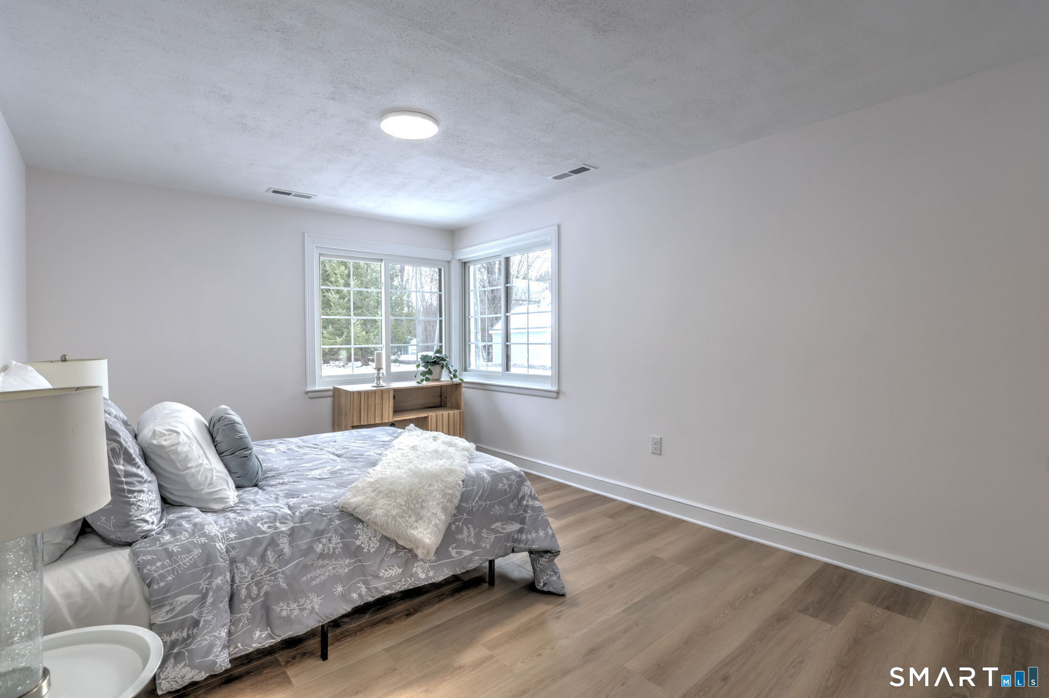 53 Geer Street Cromwell, CT 06416 - Photo 31 of 40 a living room with a bed furniture and a window