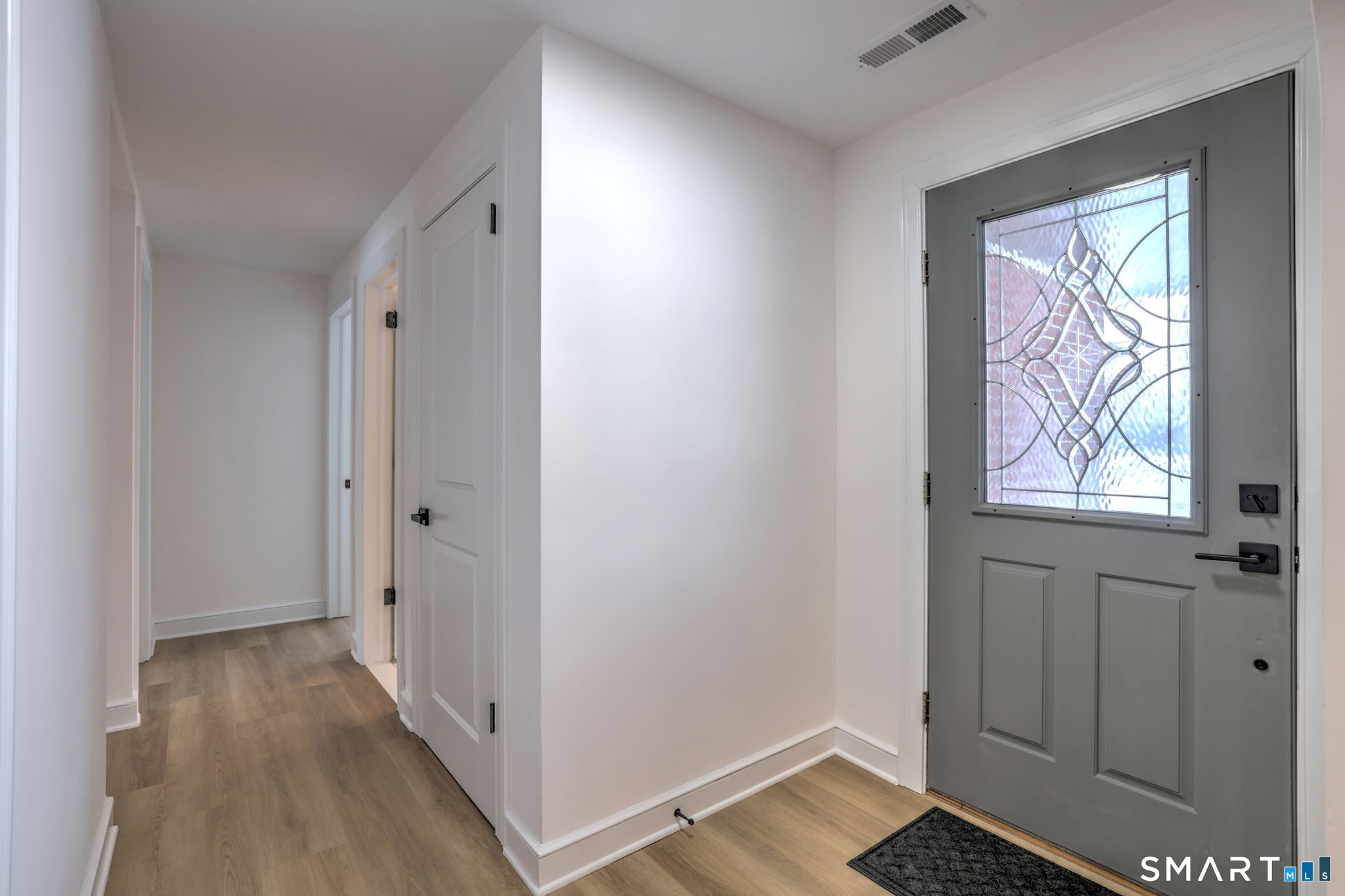 53 Geer Street Cromwell, CT 06416 - Photo 31 of 44 a view of hallway with wooden floor