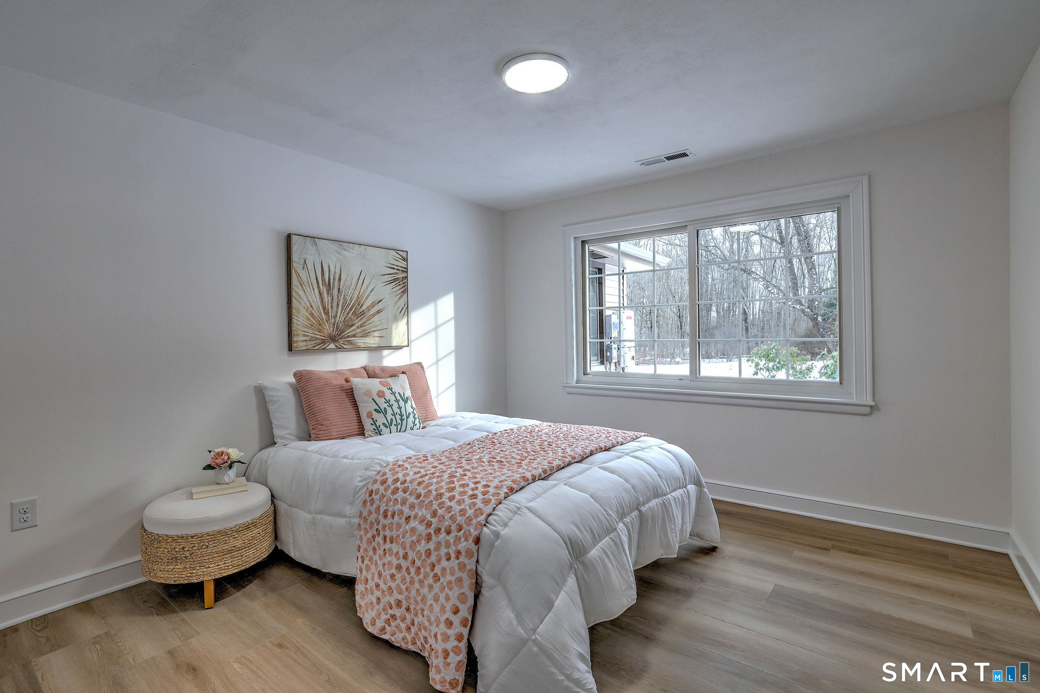 53 Geer Street Cromwell, CT 06416 - Photo 34 of 44 a bedroom with a bed and wooden floor