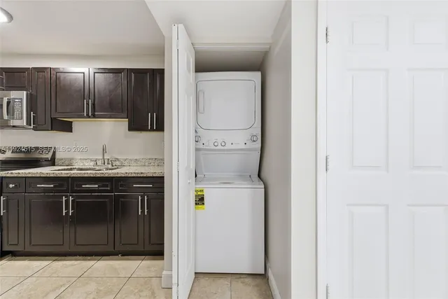 a kitchen with a sink and a stove