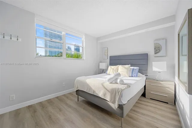 a bed room with a bed and a window