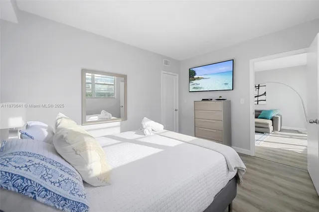 a bedroom with a bed and a dresser