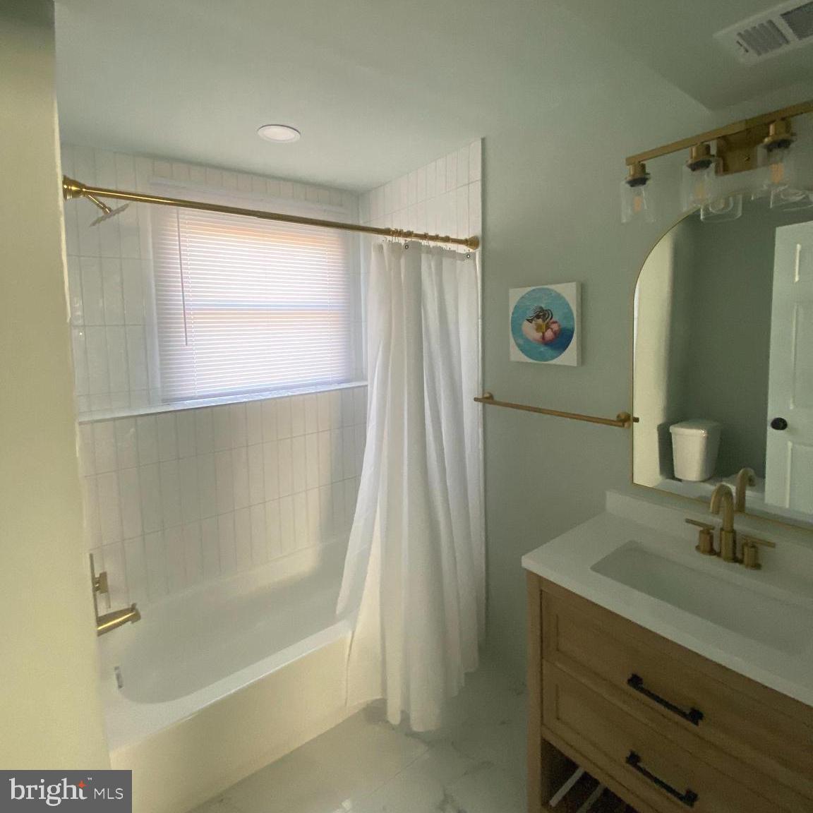 4426 Cub Run Road Chantilly, VA 20151 - Photo 16 of 20 a bathroom with a shower and a sink